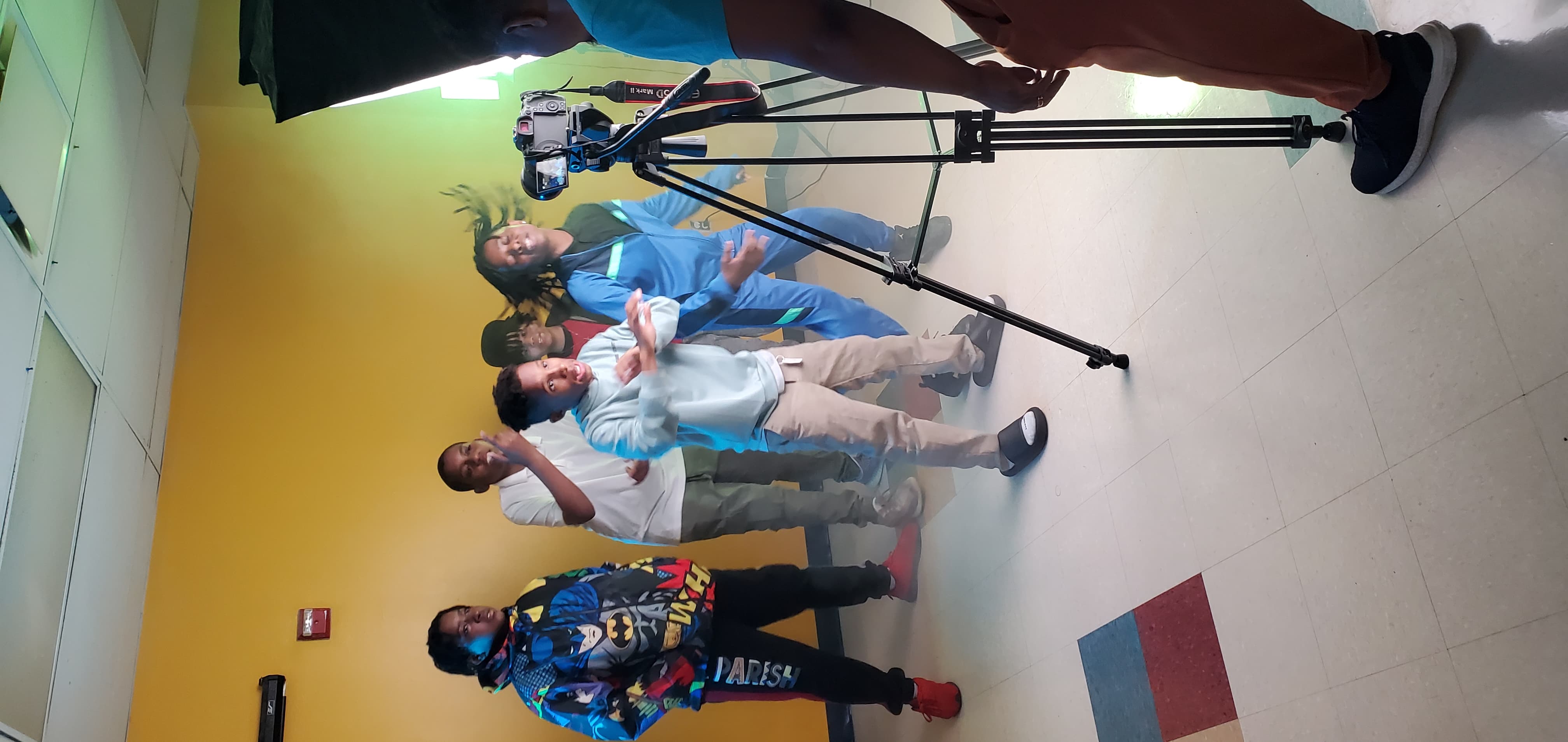 Students being filmed during video shoot of their original song