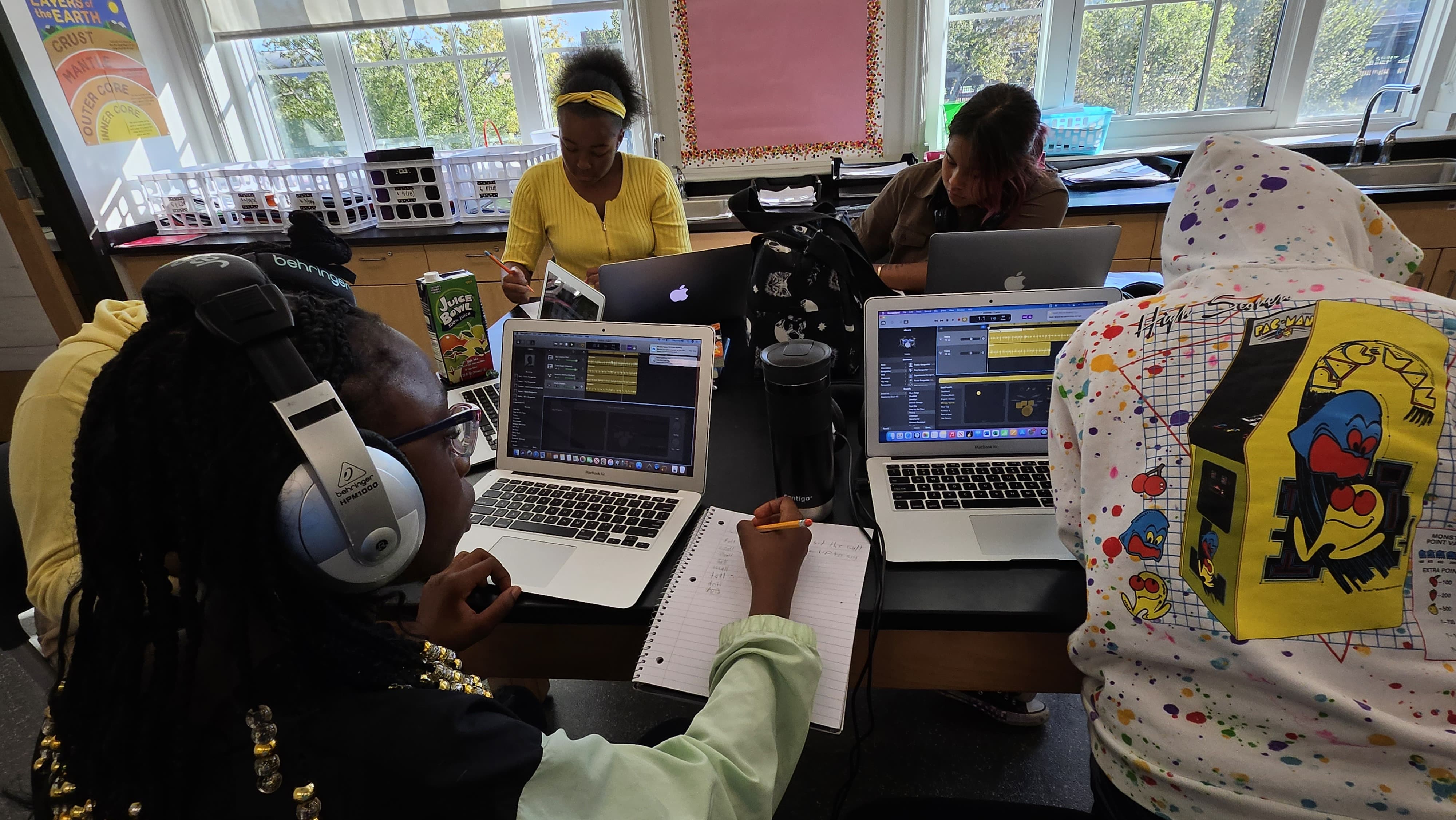 Students working on their songwriting and music production skills
